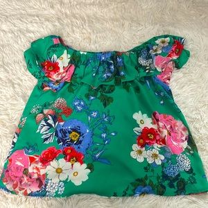 Green flower flowey shirt with cut out in the back and off the shoulder.